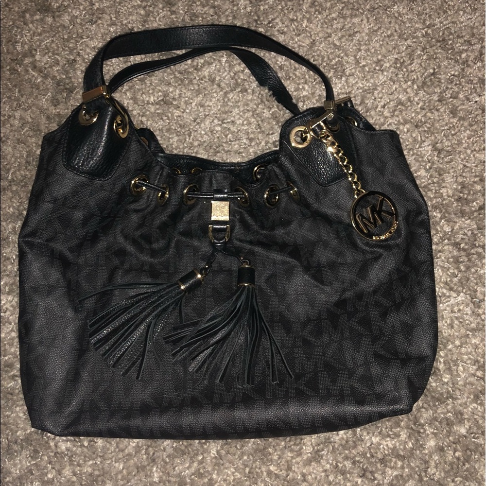 Black and gold MK purse with storing bag